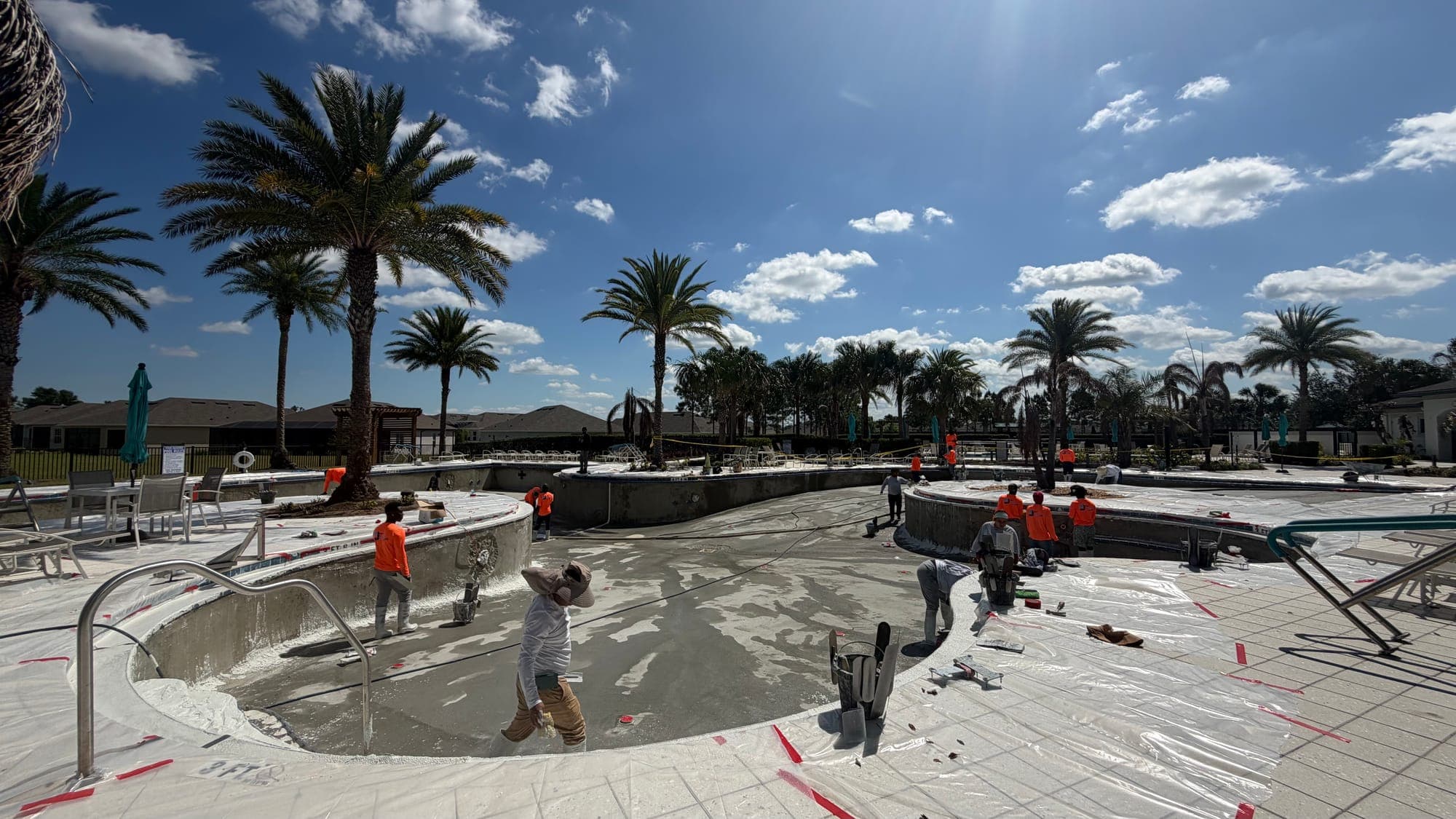 D&J crew working on a large community pool under construction