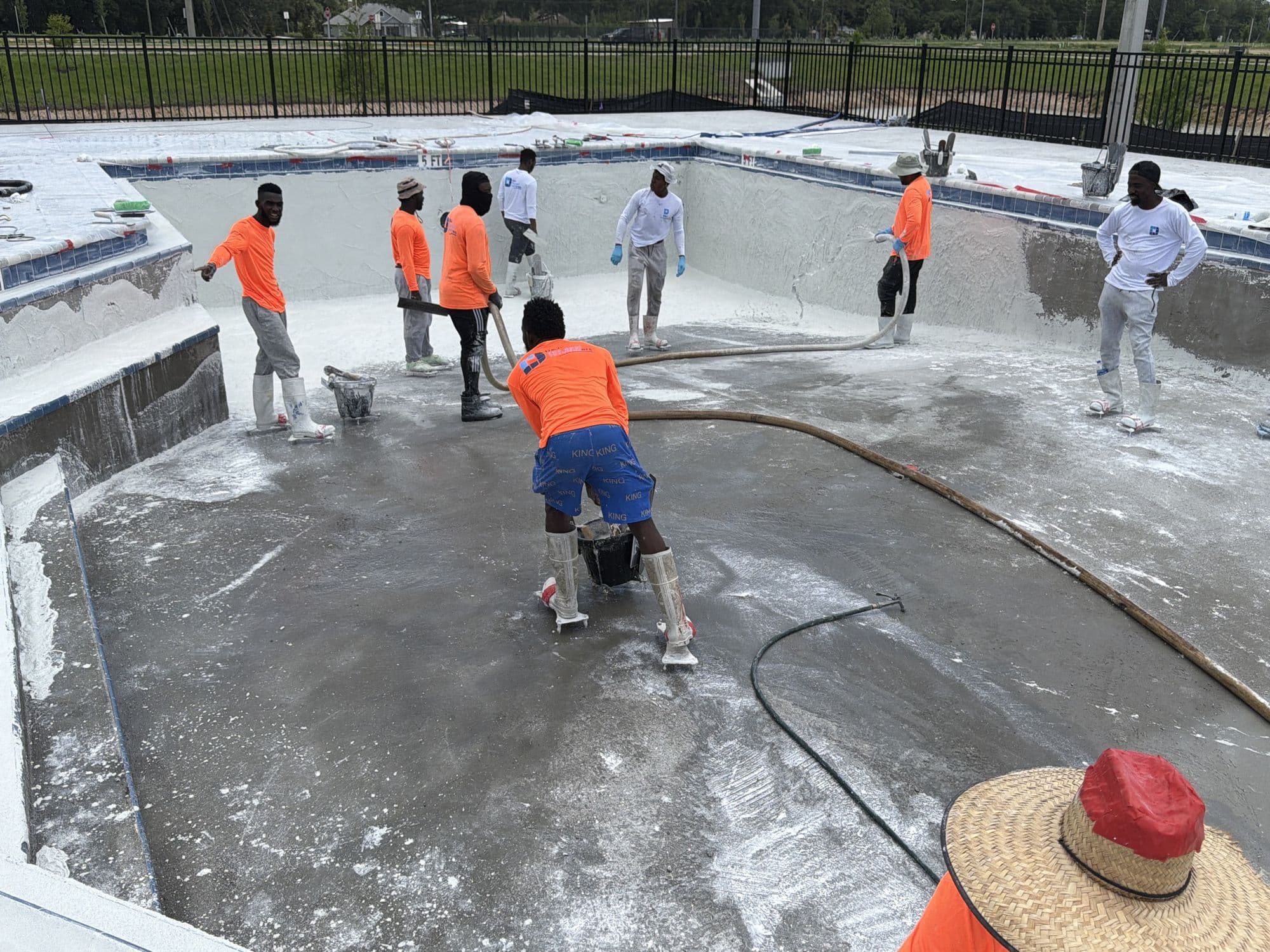 D&J crew working inside a drained commercial pool
