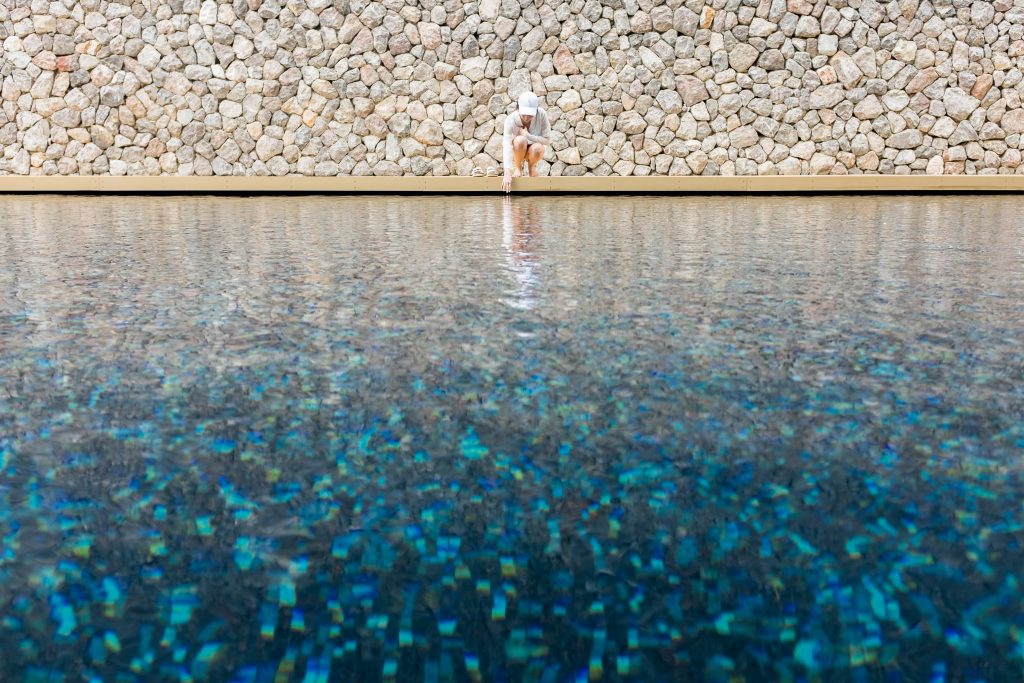 woman touching water in the pool 2026 01 07 06 21 56 utc woman touching water in the pool 2026 01 07 06 21 56 utc